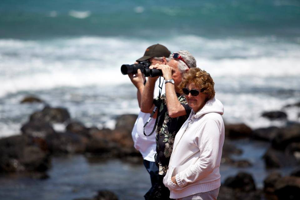 Photographer shooting at the shore